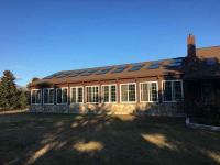 Long building with many windows and skylights